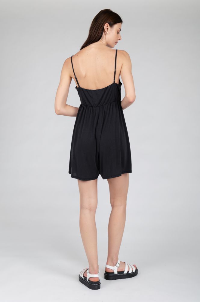 Women's effortless summer mini dress with spaghetti straps and flowing silhouette.