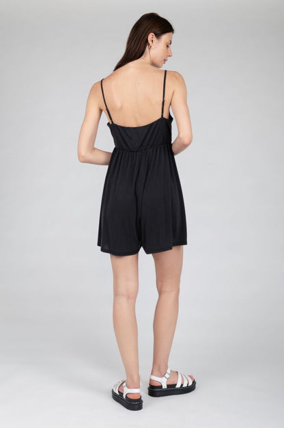 Women's effortless summer mini dress with spaghetti straps and flowing silhouette.