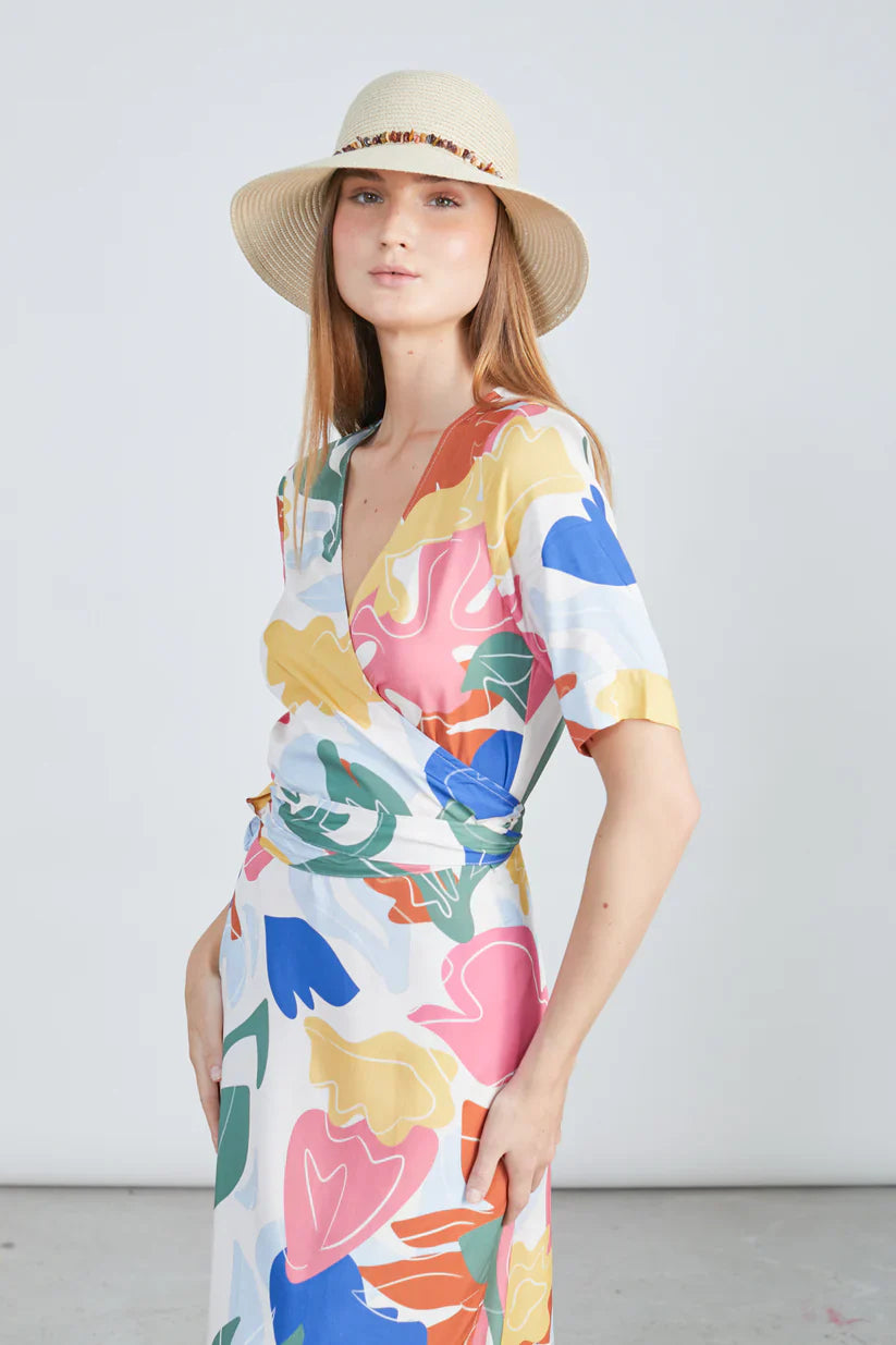 Island-ready trendy multicolor resort dress featuring modern abstract artwork print and relaxed luxury styling