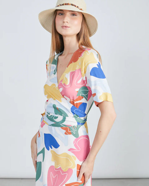 Island-ready trendy multicolor resort dress featuring modern abstract artwork print and relaxed luxury styling