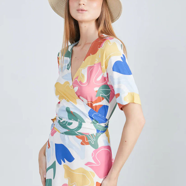 Island-ready trendy multicolor resort dress featuring modern abstract artwork print and relaxed luxury styling