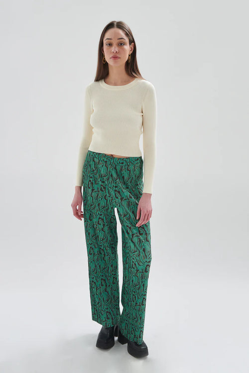 Chic women’s green patterned pants featuring flowing tailored fit and eye-catching swirl print for elevated casual fashion.