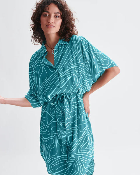 Contemporary teal belted shirt dress with loose fit and graphic print for elevated casual women’s fashion.