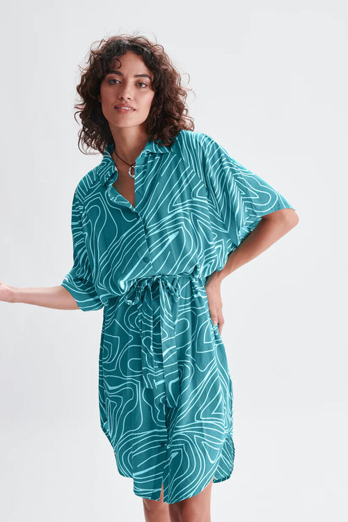 Contemporary teal belted shirt dress with loose fit and graphic print for elevated casual women’s fashion.