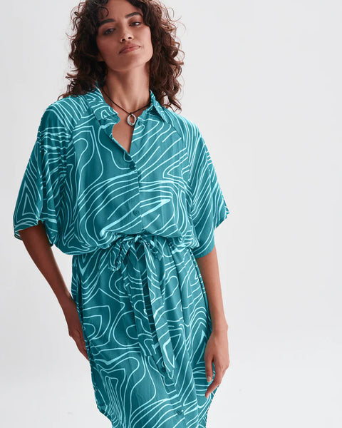 Lightweight turquoise midi shirt dress with cinched waist and oversized silhouette for beach-to-brunch styling.