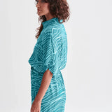 Women’s oversized teal shirt dress with modern line art print and drawstring waist for effortless chic looks.