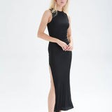 Trendy black sleeveless side slit dress with minimalist design perfect for vacation, brunch, and evening looks.
