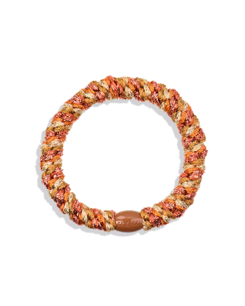 Soft braided hair tie in warm orange and neutral tones with stretch elastic design for all-day comfortable hold and no hair pulling.