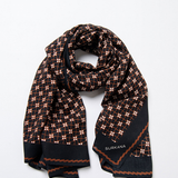 Surkana women’s black geometric print scarf with rust brown and white pattern for chic layering, travel outfits, and stylish everyday accessories.