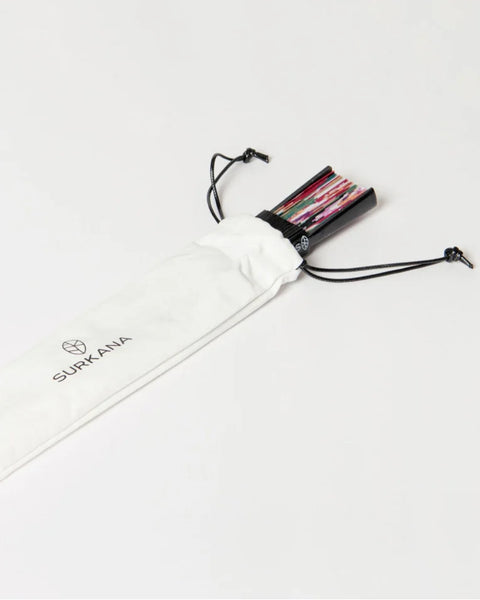 Compact folding fan featuring soft floral artwork and durable bamboo construction for weddings, travel, festivals, and outdoor dining.