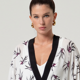 Stylish open-front floral kimono with relaxed sleeves and versatile silhouette for effortless boutique fashion.