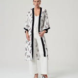 Elegant open-front kimono jacket in ivory with delicate floral print, perfect for casual chic outfits, vacations, and special occasions.