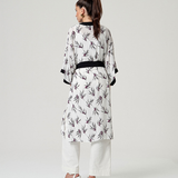 Women's statement floral kimono jacket crafted from breathable fabric for effortless summer layering and vacation wardrobes.