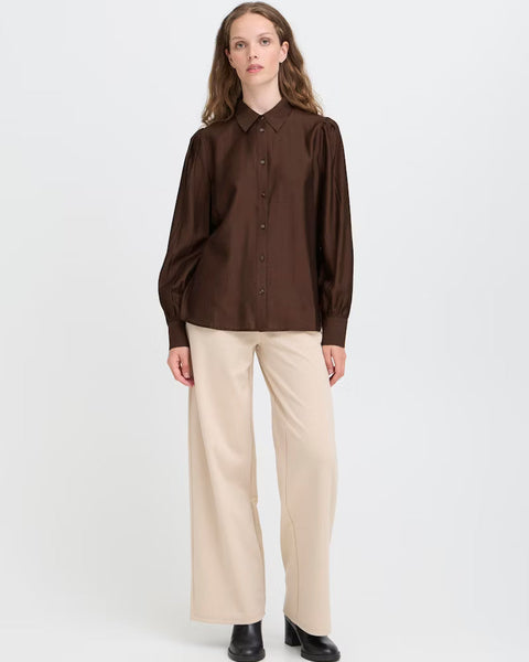 Women’s chocolate brown satin-look blouse with collared neckline and puff sleeves for sophisticated fall and winter styling.