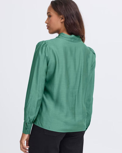 Women’s emerald green satin-look blouse with collared neckline and puff sleeves for elevated professional and evening fashion.