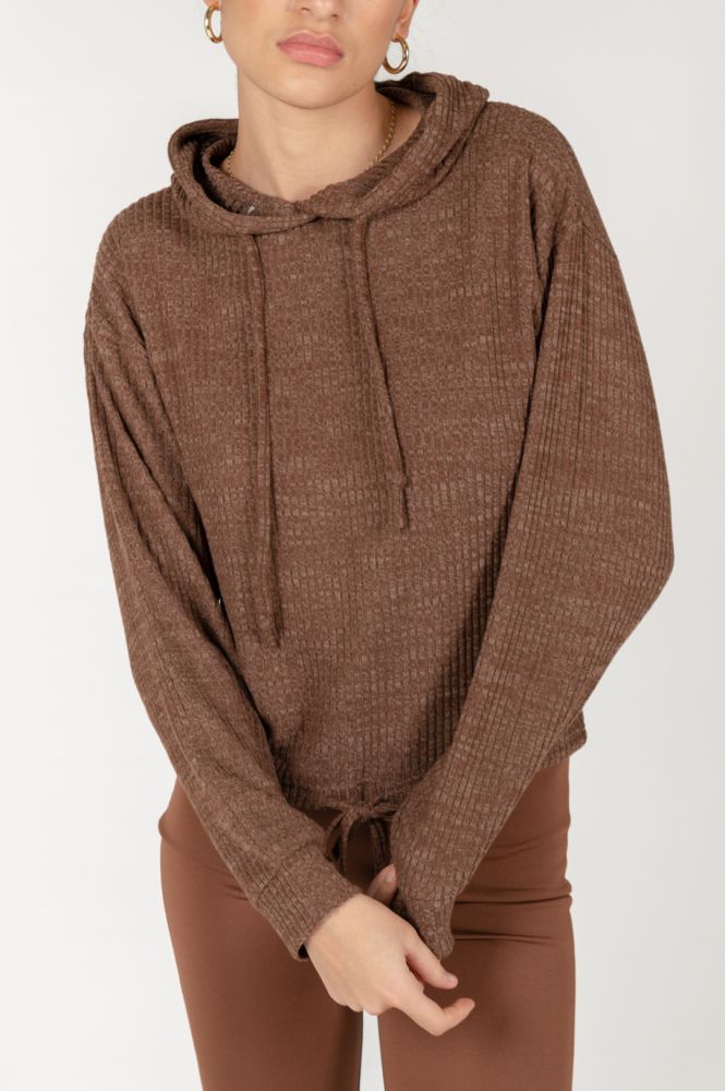 Women's brown waffle knit hoodie with drawstring hood and relaxed oversized fit.