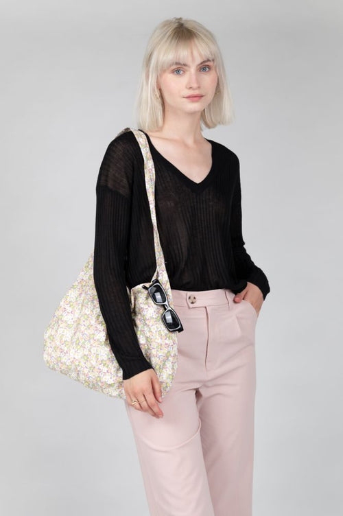 Lightweight black sweater designed for effortless everyday elegance and versatility.