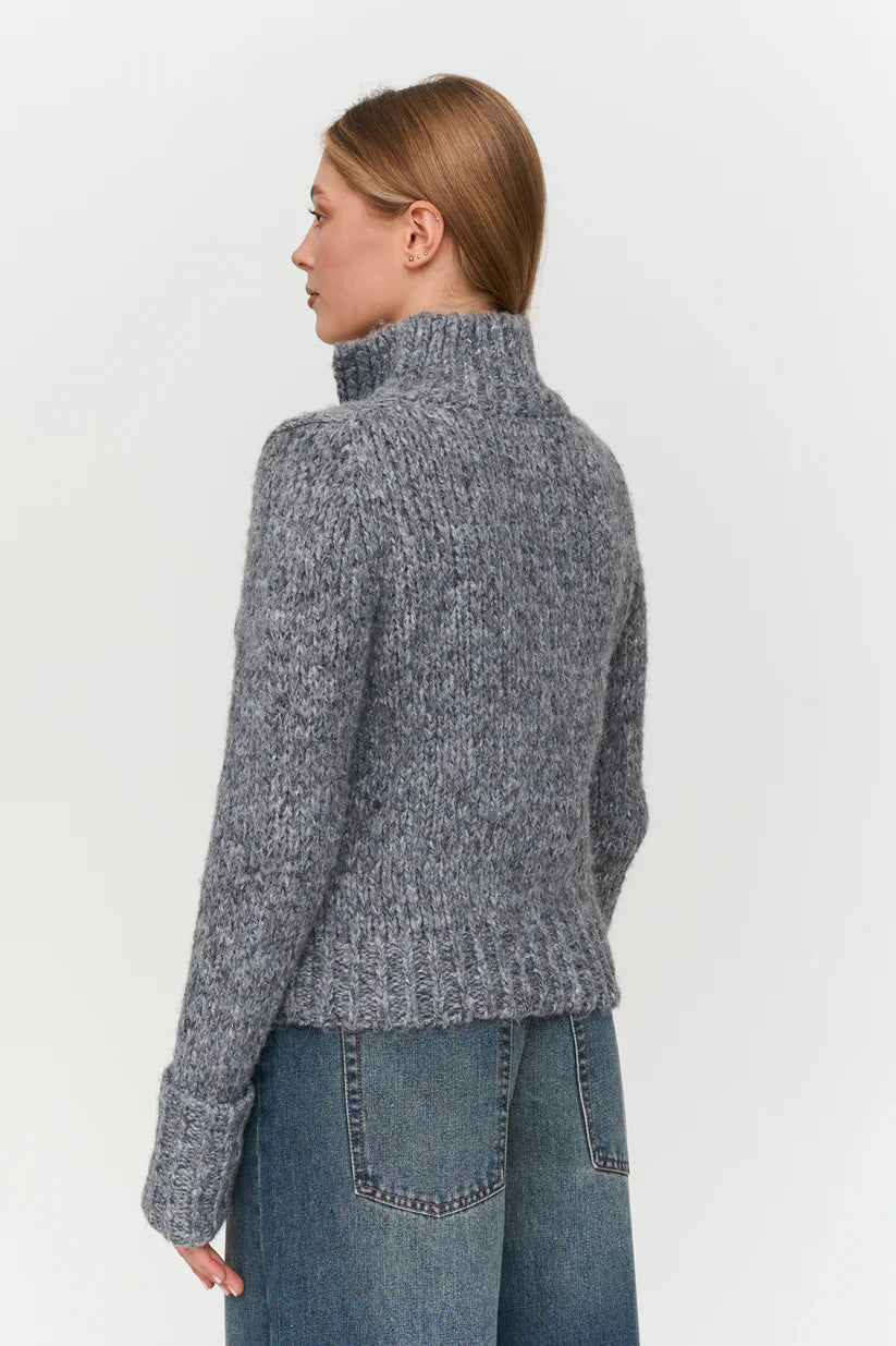 Gray chunky knit pullover sweater for women with high neck and textured knit for stylish cold-weather outfits.