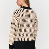 Women’s statement animal print sweater in black and cream for chic everyday fall and winter outfits.