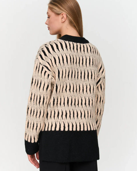 Women’s statement animal print sweater in black and cream for chic everyday fall and winter outfits.