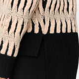 Trendy women’s zebra print knit sweater in cream and black for chic casual and elevated everyday outfits.