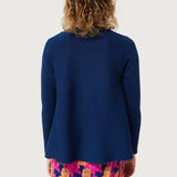 Women’s navy blue knit sweater with minimalist silhouette and playful cat print pants for modern casual fashion.