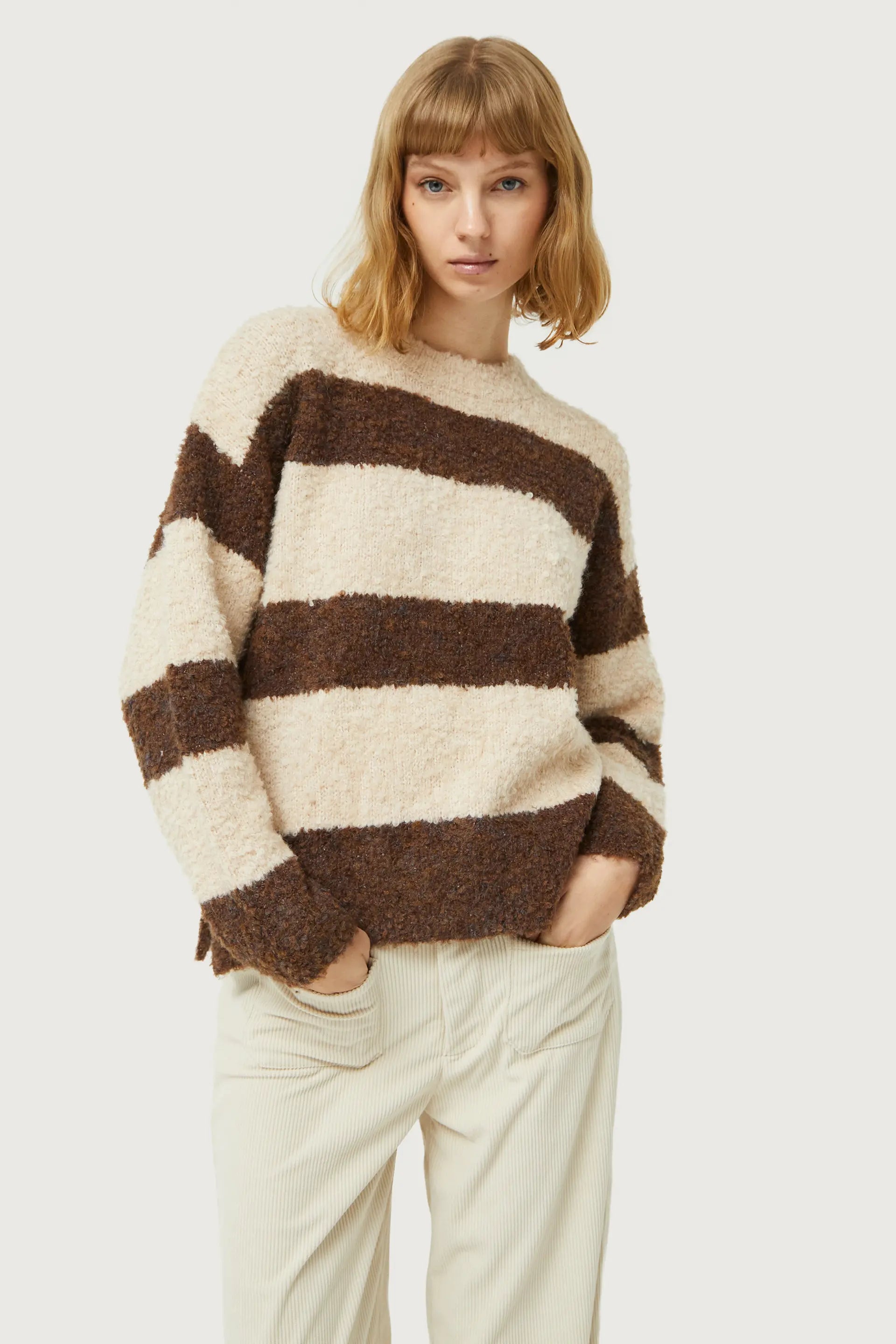Soft boucle knit striped sweater featuring neutral earth tones and relaxed contemporary casual styling.