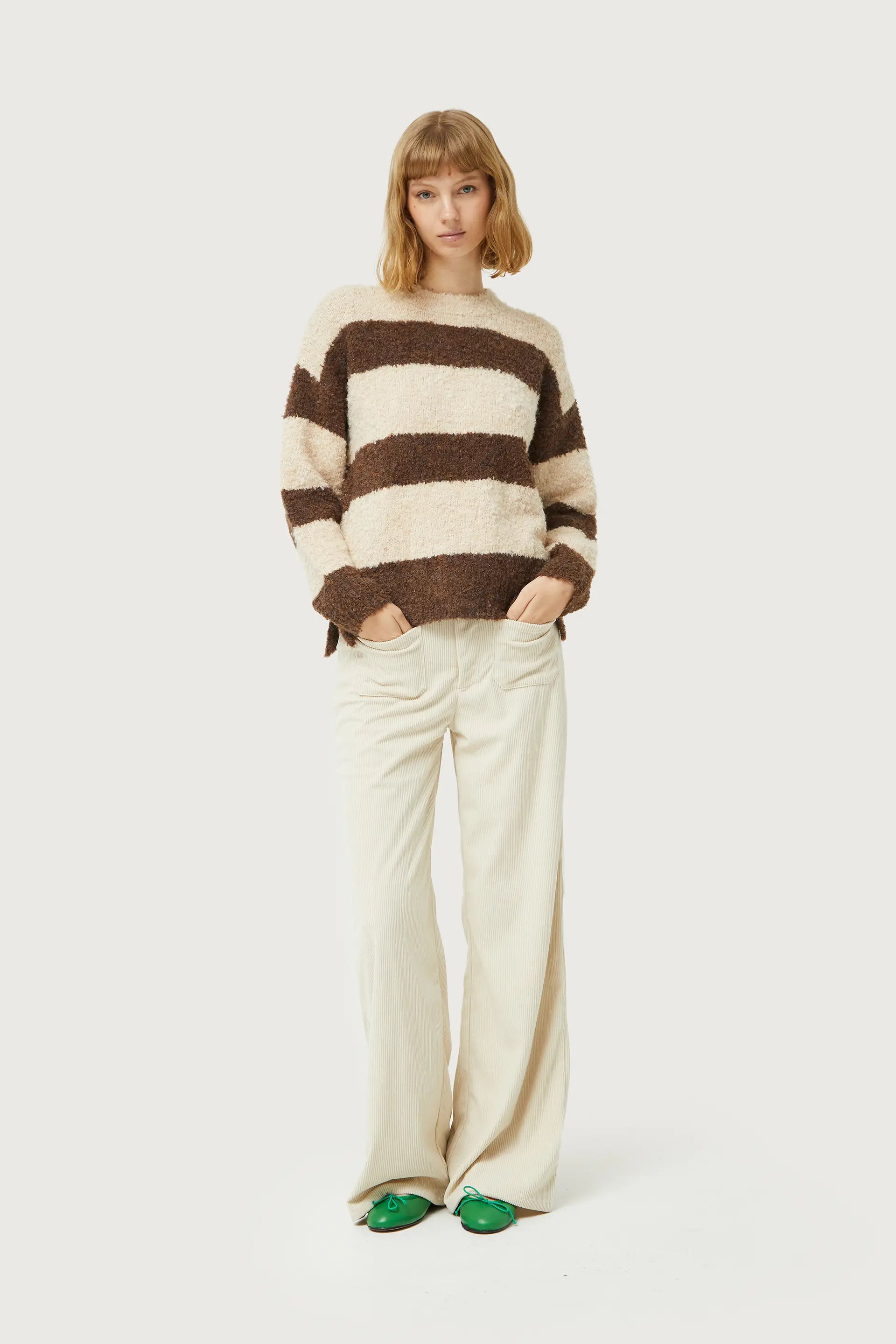 Contemporary fuzzy stripe sweater in neutral tones with relaxed fit and timeless cold-weather fashion style.