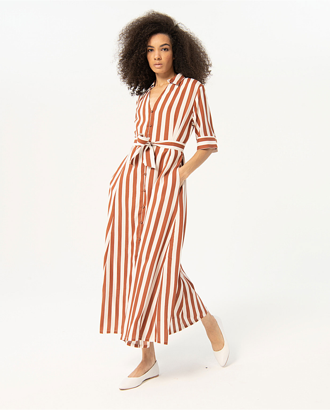 Women’s terracotta striped belted dress with elegant shirt-style design and breezy silhouette for modern resort chic looks.