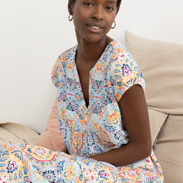 Fashion-forward boho maxi dress with flutter sleeves and lightweight flowy silhouette for summer occasions.