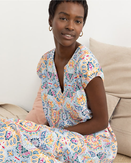 Fashion-forward boho maxi dress with flutter sleeves and lightweight flowy silhouette for summer occasions.