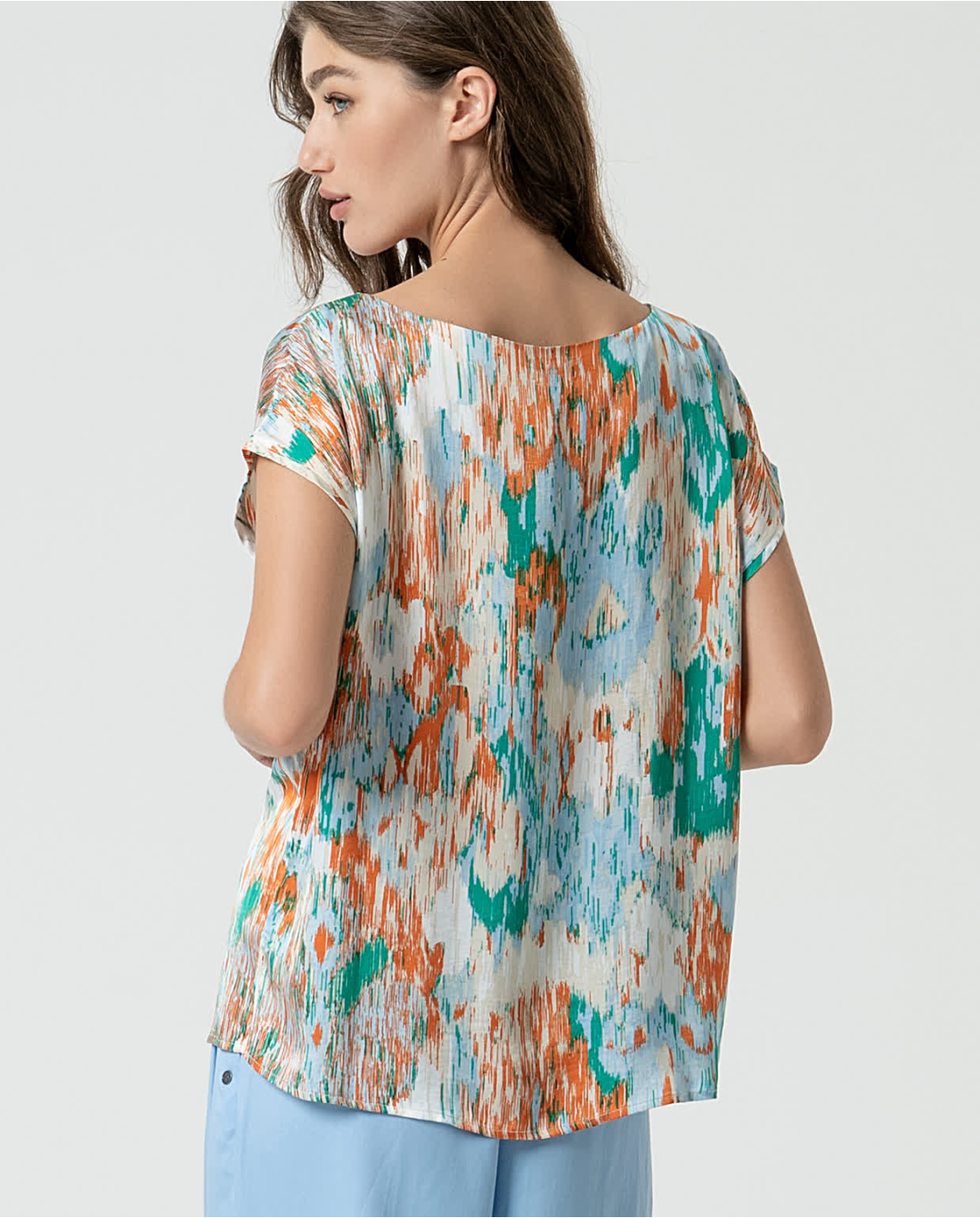 Casual luxe multicolor blouse with painterly print and modern capsule wardrobe appeal.