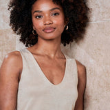 Women's neutral metallic knit camisole with wide shoulder straps, V-neckline and subtle shimmer for elevated casual and evening outfits.