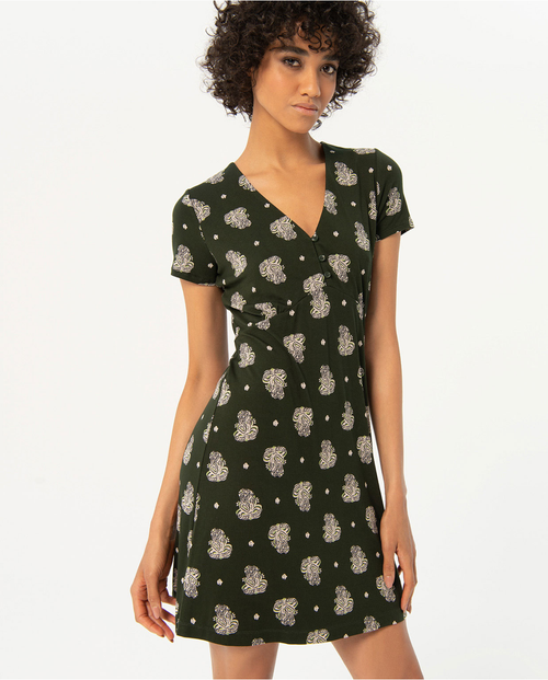 Feminine short sleeve mini dress with botanical print and elegant V-neck cut for trendy summer wardrobe essentials.