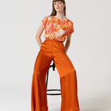 Rust orange wide-leg palazzo trousers for casual and dressy outfits.
