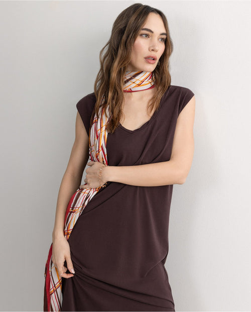 Chic sleeveless midi maxi dress with relaxed drape and effortless contemporary evening style.