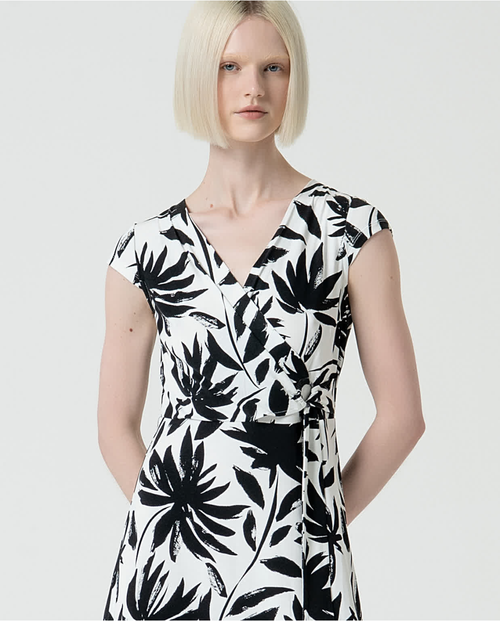 Contemporary women’s summer dress with abstract palm print and polished day-to-night styling.