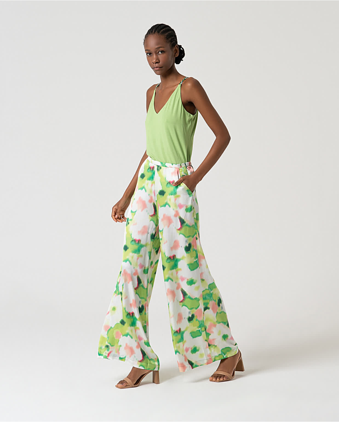 Trendy women’s floral wide leg pants with watercolor print and relaxed luxe summer outfit aesthetic.