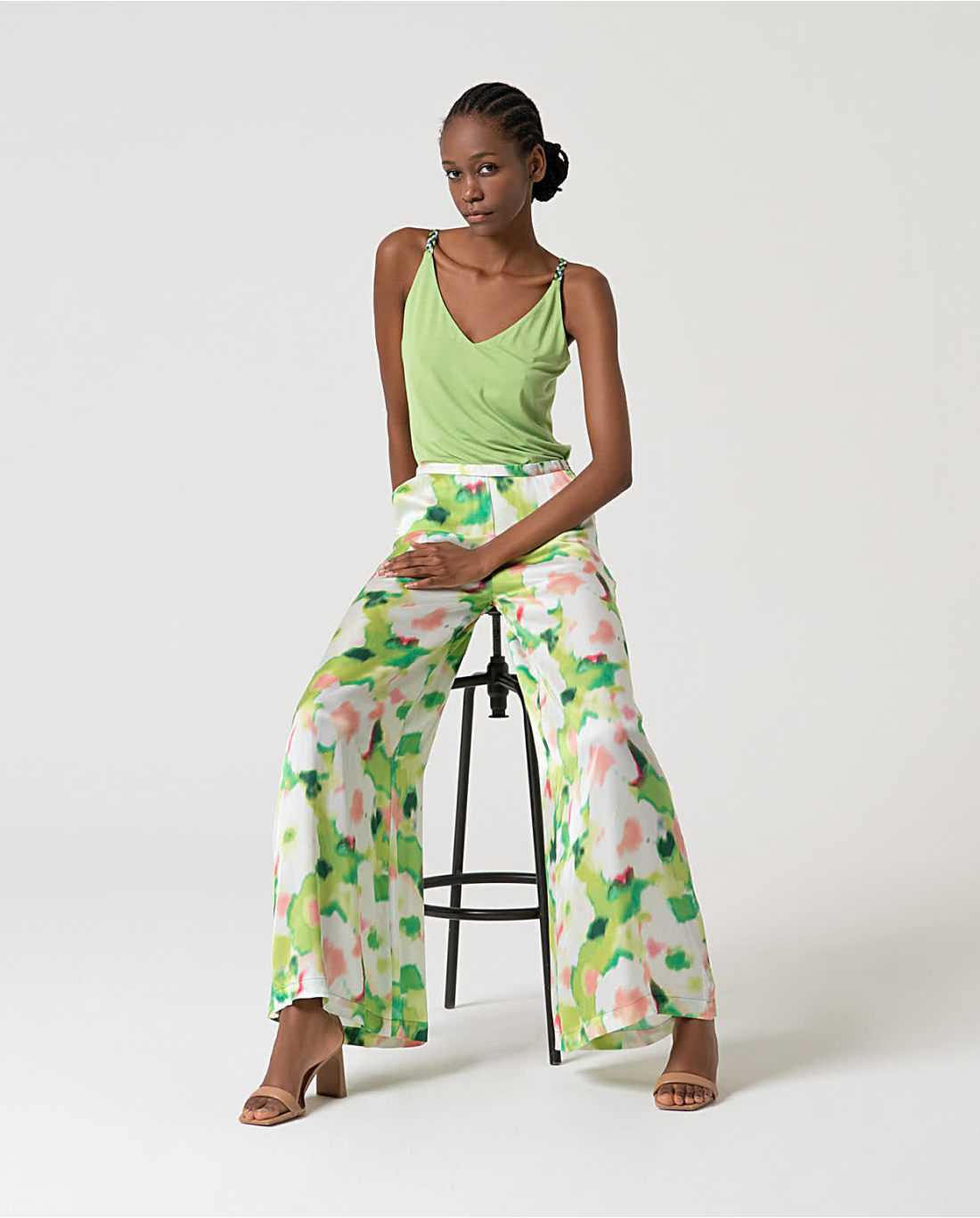Elegant women’s wide leg pants outfit with abstract botanical print and contemporary spring summer styling.