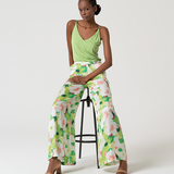 Elegant women’s wide leg pants outfit with abstract botanical print and contemporary spring summer styling.