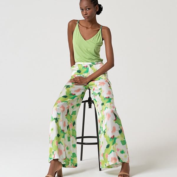Elegant women’s wide leg pants outfit with abstract botanical print and contemporary spring summer styling.
