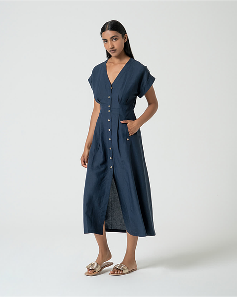 Fashion-forward navy day dress with flattering pleated waist and chic understated luxury vibe.