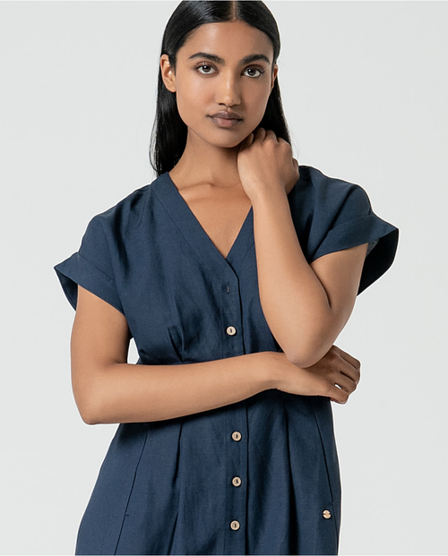 Minimalist navy midi dress with rolled sleeves and flattering relaxed tailored fit for everyday elegance.