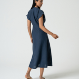 Lightweight navy summer dress with tailored seams and elevated minimalist boutique style.