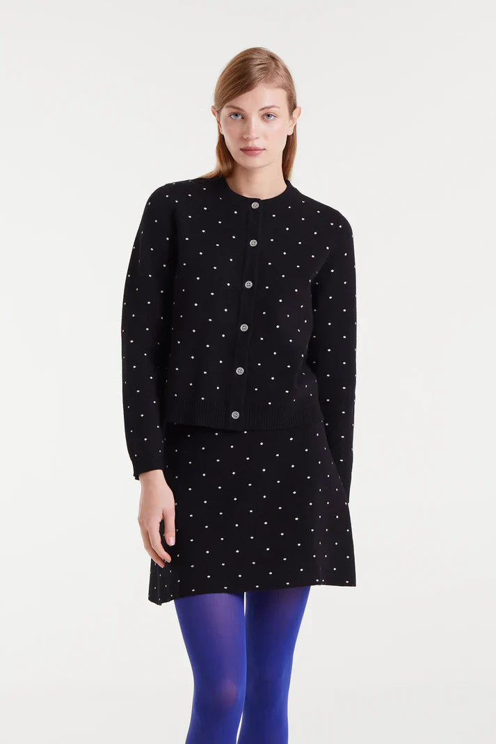 Boutique women's black and white spotted cardigan with button front and classic crew neckline for sophisticated everyday layering.