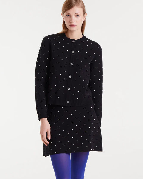 Boutique women's black and white spotted cardigan with button front and classic crew neckline for sophisticated everyday layering.