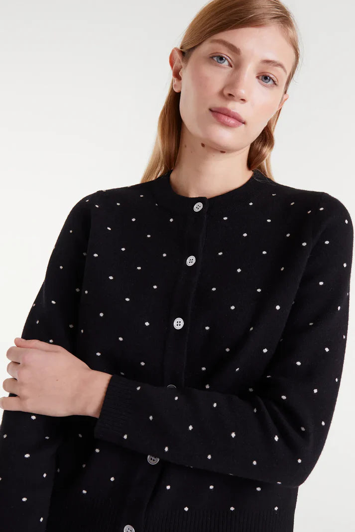 Women's lightweight black knit cardigan with all-over white dot pattern, round neckline and long sleeves for polished transitional styling.