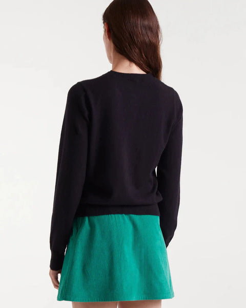 Black button-front cardigan featuring colorful heart buttons in pink, blue, green and red for fun contemporary women's style.