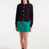 Boutique women's black crew neck cardigan featuring bright multicolor heart buttons and fine knit texture for a playful statement look.