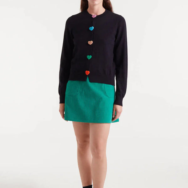 Boutique women's black crew neck cardigan featuring bright multicolor heart buttons and fine knit texture for a playful statement look.